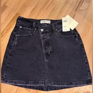 Asymmetrical black denim skirt